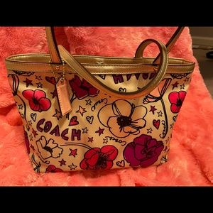 Coach print cloth handbag with wallet.